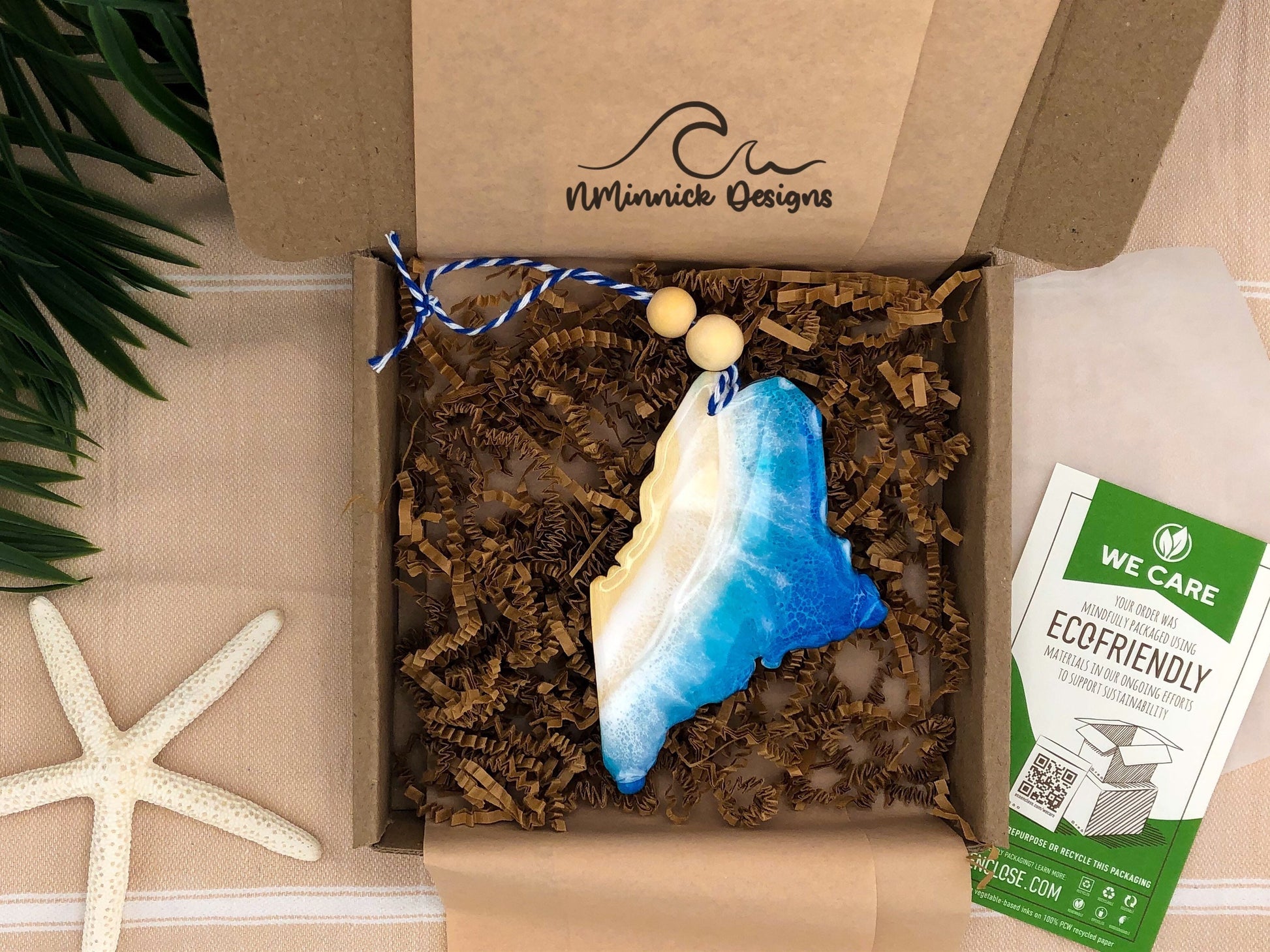 Maine beach ornament packaged in ecofriendly plastic free materials with recyclable box, tissue paper and paper shred.