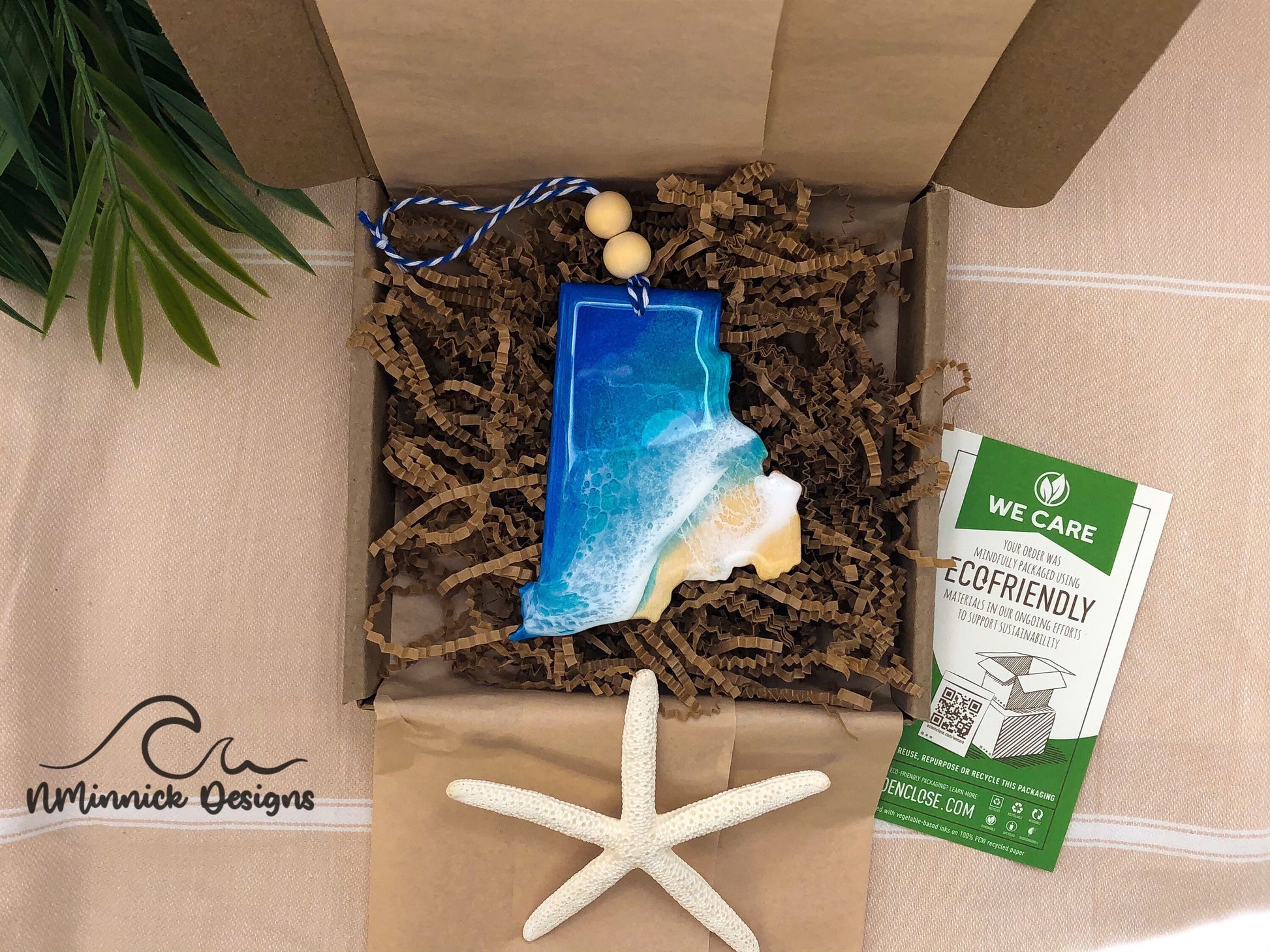 Rhode Island Ocean Resin Ornament packaged in ecofriendly plastic free materials with recyclable box, tissue paper and paper shred.