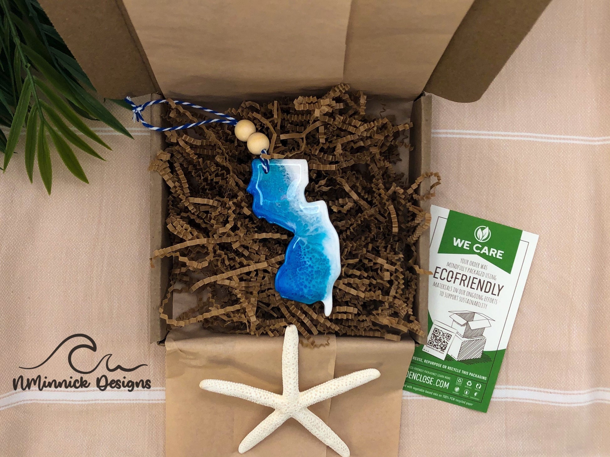 New Jersey Beach Scene ornament packaged in ecofriendly plastic free materials with recyclable box, tissue paper and paper shred.