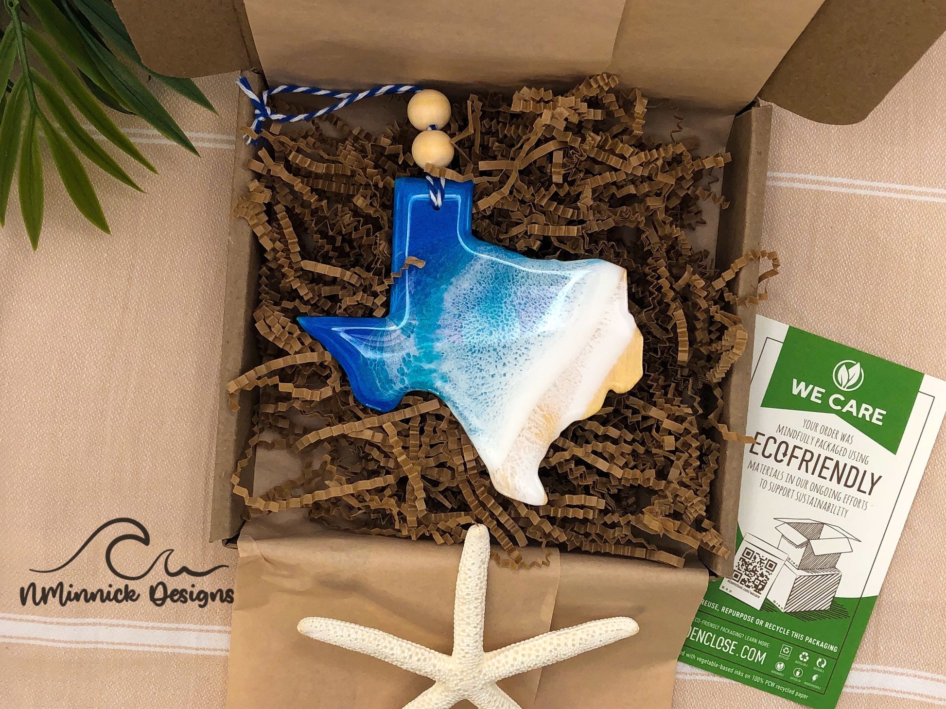 Texas Beach ornament packaged in ecofriendly plastic free materials with recyclable box, tissue paper and paper shred.