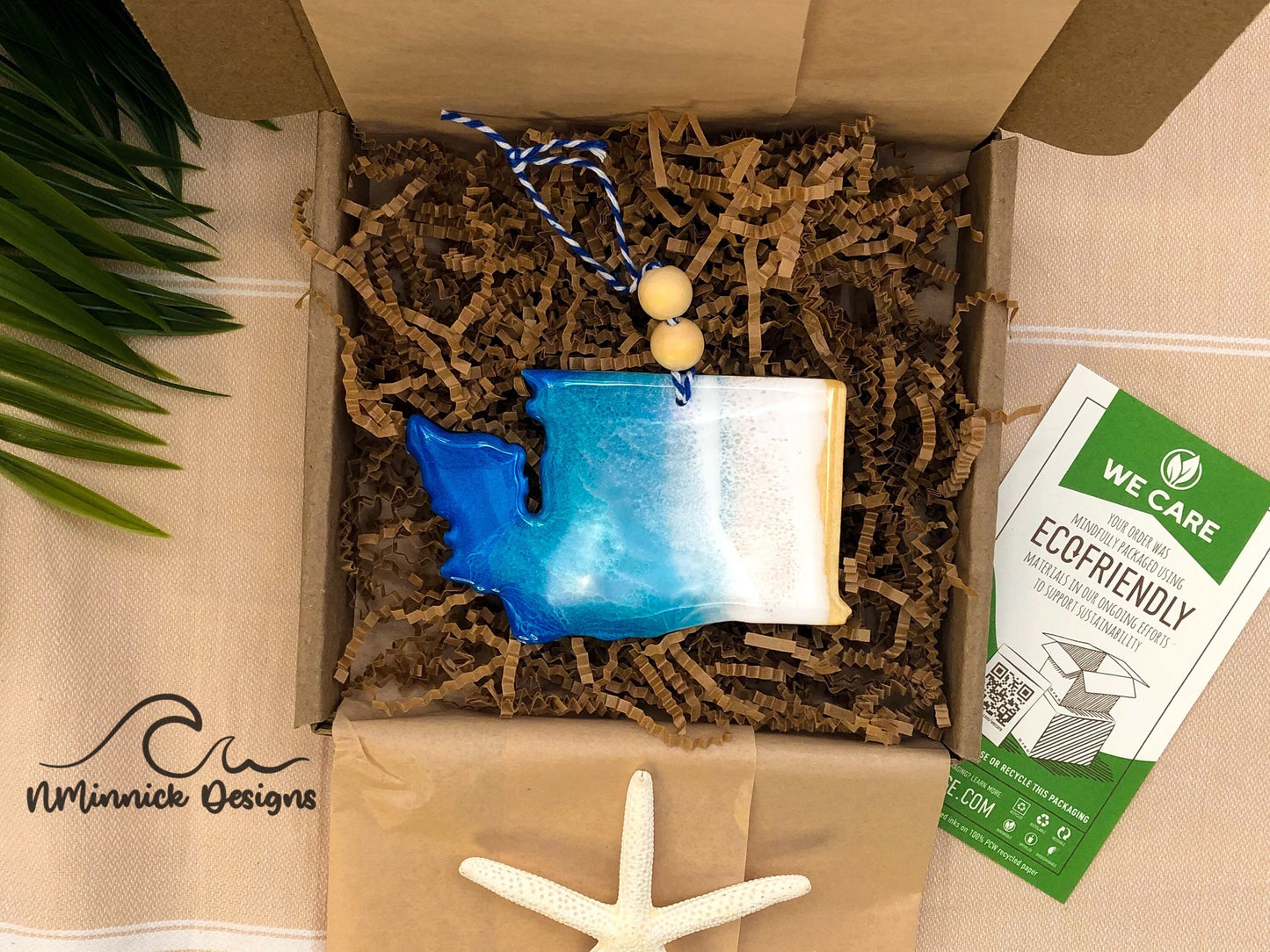 Washington Wood and Resin Beach Ornament packaged in ecofriendly plastic free materials with recyclable box, tissue paper and paper shred.