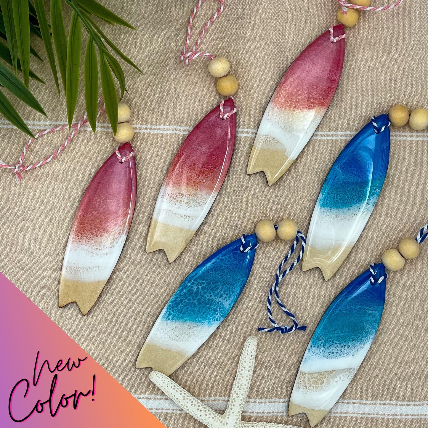 Surfboard shaped wooden christmas ornament covered in ocean resin art resembling the waves of the sea. Available in two colors - Ocean Blue and Pink Sunrise. Finished with baker&#39;s twine and two wooden beads.