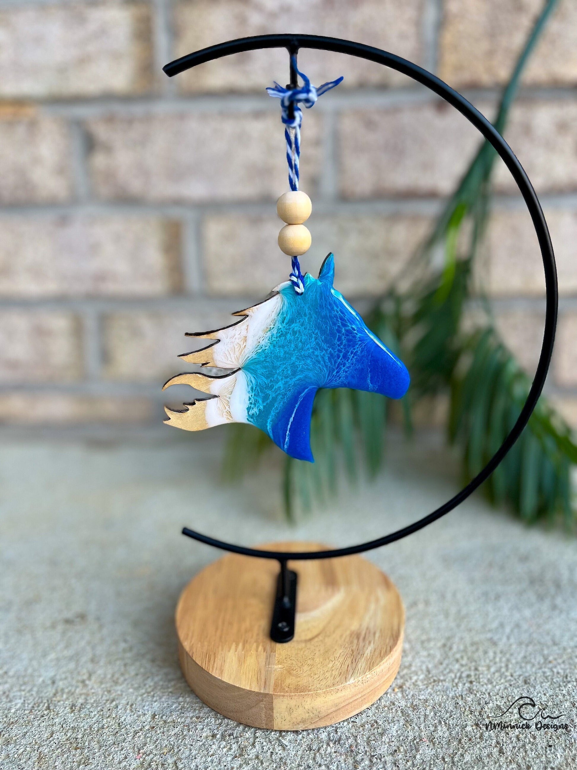 Horse Ornament with ocean resin art hanging on an ornament stand.