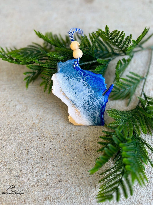 Wisconsin shaped wood ornament adorned with dark blue and grey blue resin waves inspired by the great lakes