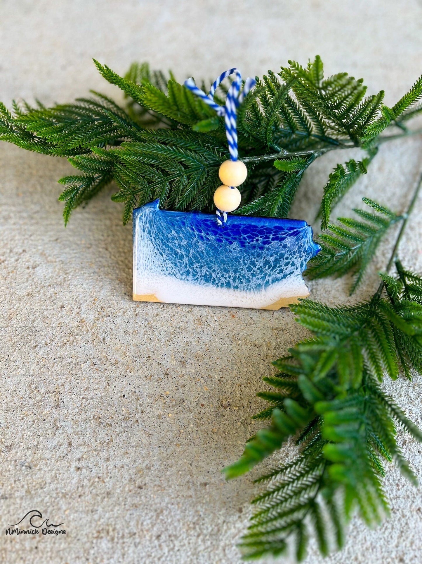 Pennsylvania shaped wood ornament with dark blue and grey blue resin waves inspired by lake erie