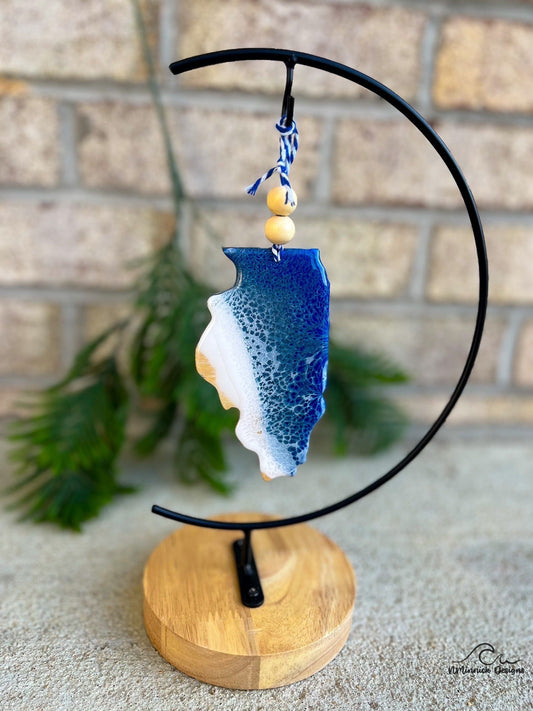 Illinois shaped wood ornament adorned with dark blue and grey blue resin waves inspired by the great lakes