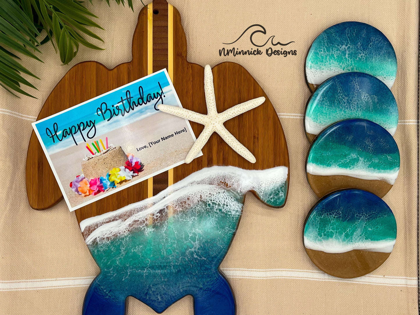 Sea turtle-shaped bamboo serving board covered in aoi hi blue and okinawa green ocean resin art to resemble waves of the ocean.  Matching set of 4 drink coasters with matching colored ocean resin scenes and cork backings.  Includes a Happy Birthday Card.